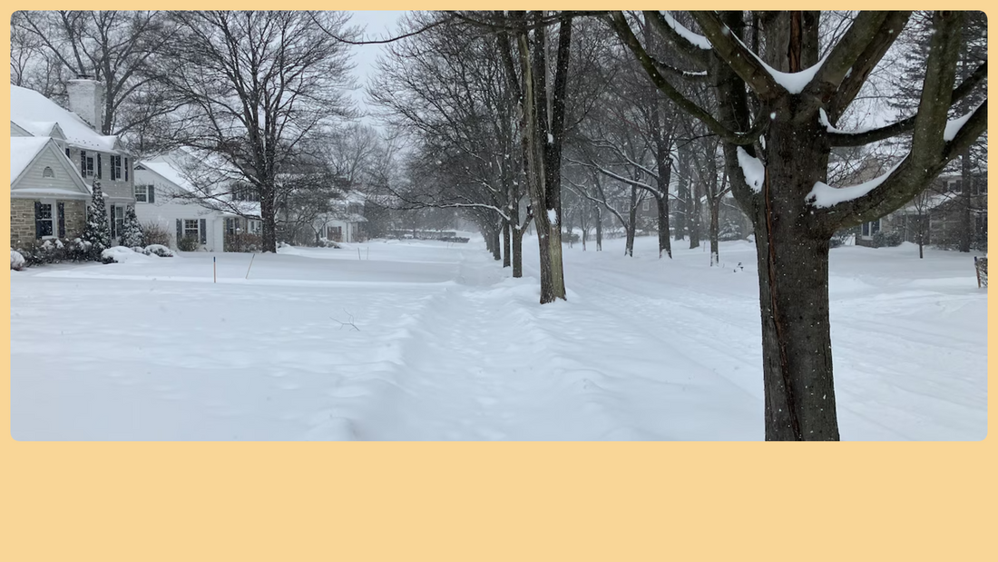 Heavy snowfall and plows clearing icy Central Ohio highway